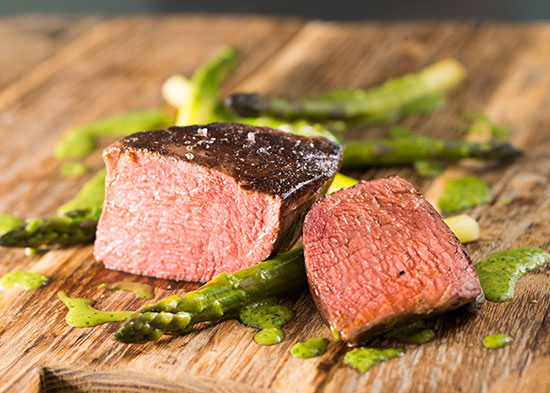 Sous Vide Tenderloin Steaks with Asparagus and Onions